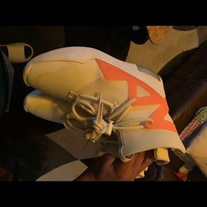 Fear of god one is green the other is pink basketball shoes